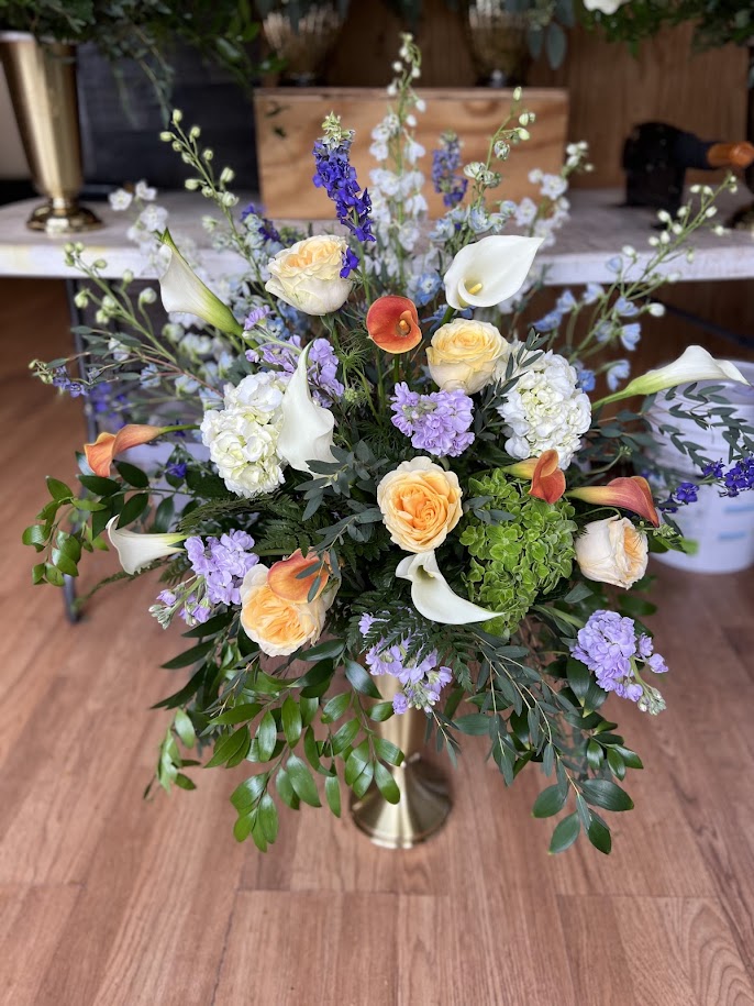 Pink roses with peach hydrangea and green viburnum